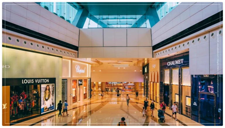 Indian shoppers carrying luxury brand bags in a high-end mall