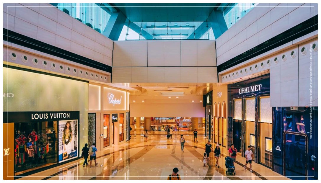 Indian shoppers carrying luxury brand bags in a high-end mall