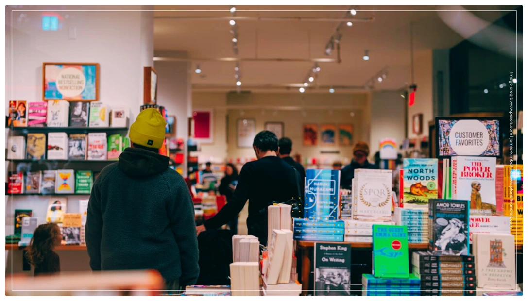 People browsing and buying books in a bookstore