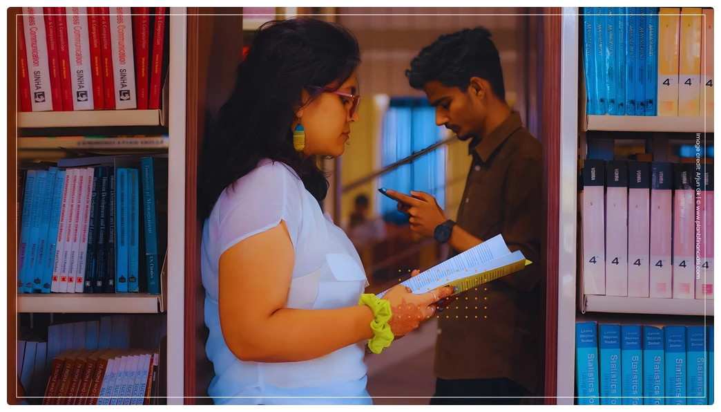 Young woman reading a financial education book near a library shelf